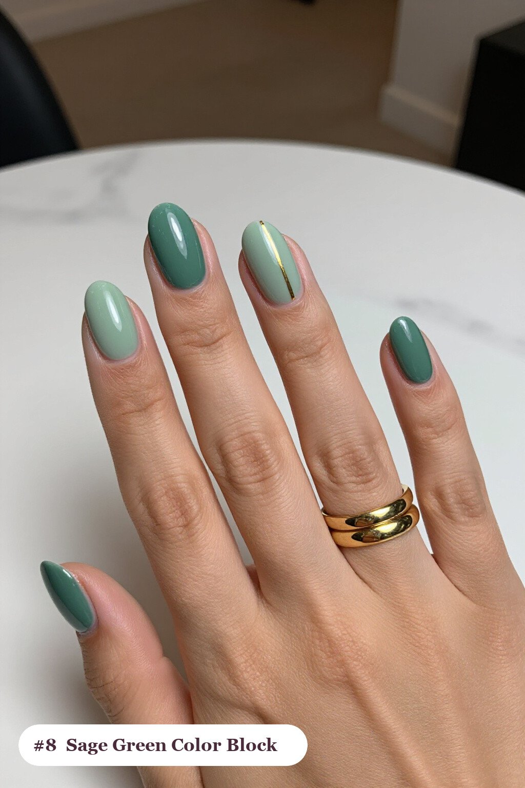 Medium oval sage green nails in a colour-block design split diagonally with a thin gold line, thanksgiving style - thanksgiving acrylic nail ideas