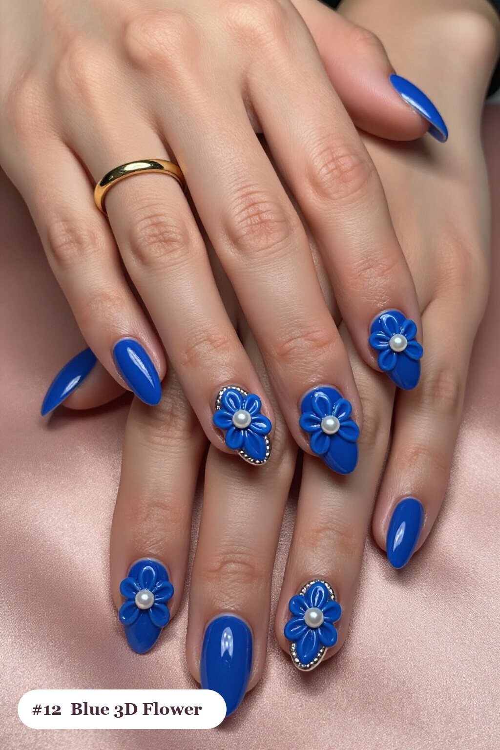 3D Pearl‑Center Flowers on Medium Almond Nails with Silver Chrome Details - winter blue nails