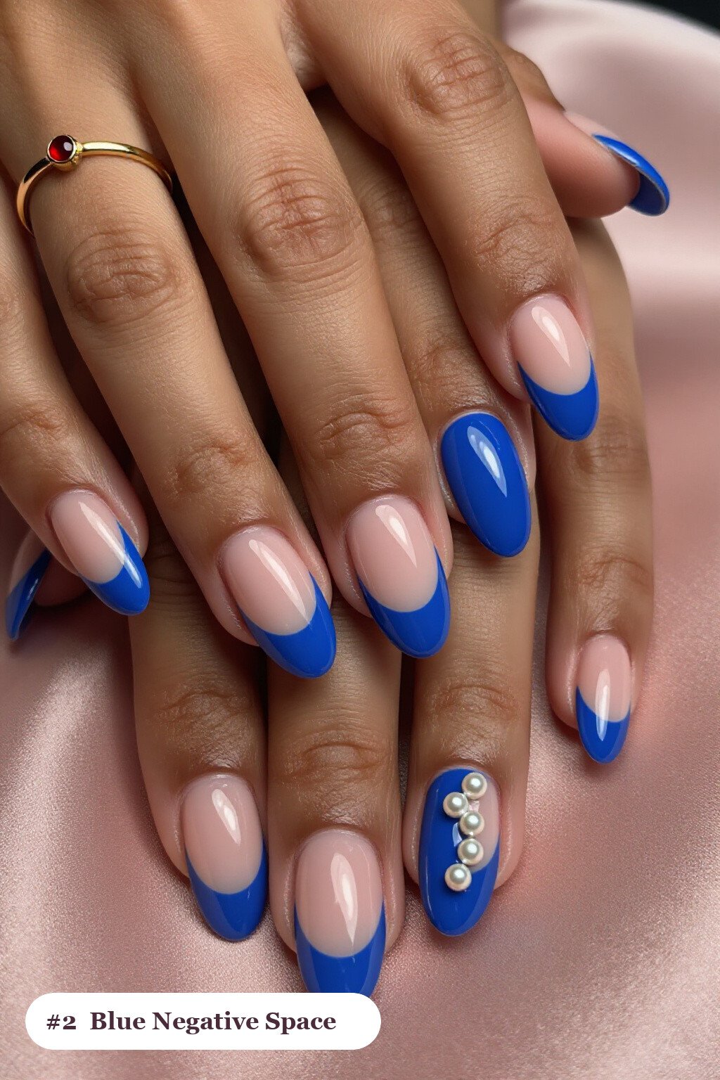 Negative‑Space Medium Almond Nails with Sheer Nude Windows and Pearl Accents - winter blue nails