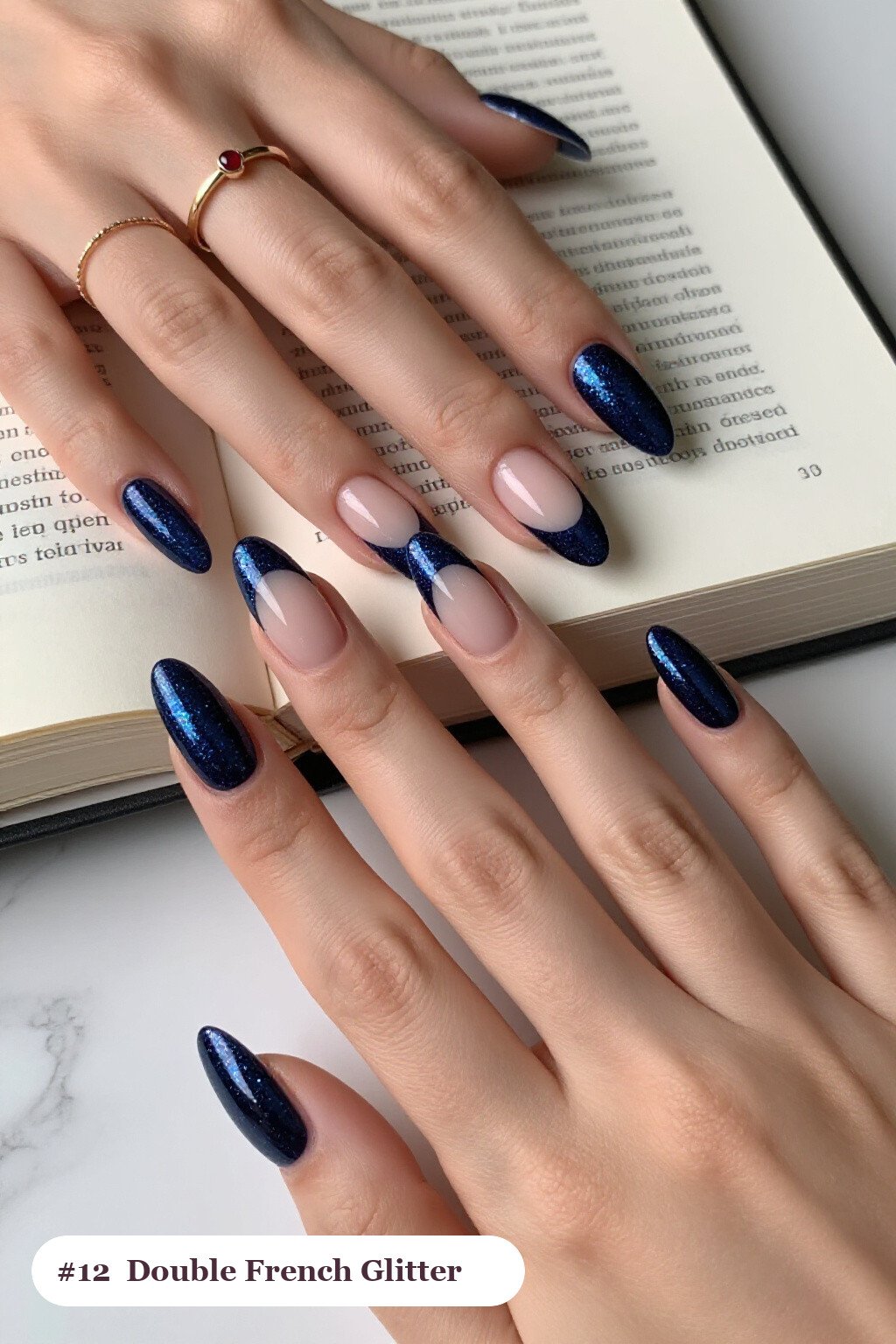 Long ballerina deep navy glitter nails with sparkling glitter clearly visible on every nail, styled with double-line french tips in two colours, perfect for winter - winter glitter nails