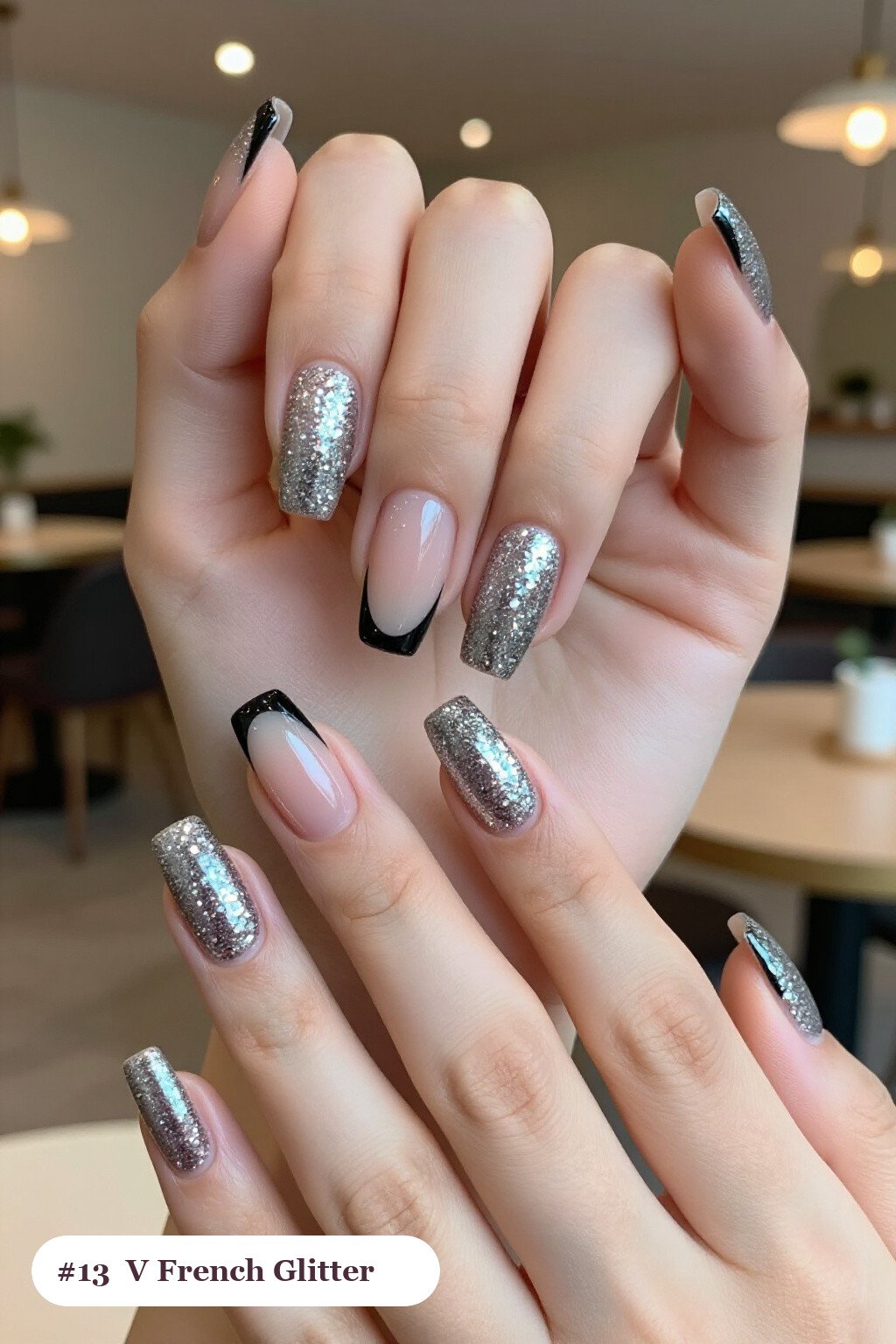 Medium square silver glitter nails with sparkling glitter clearly visible on every nail, styled with deep V-shaped french tips in a bold contrasting colour, perfect for winter - winter glitter nails