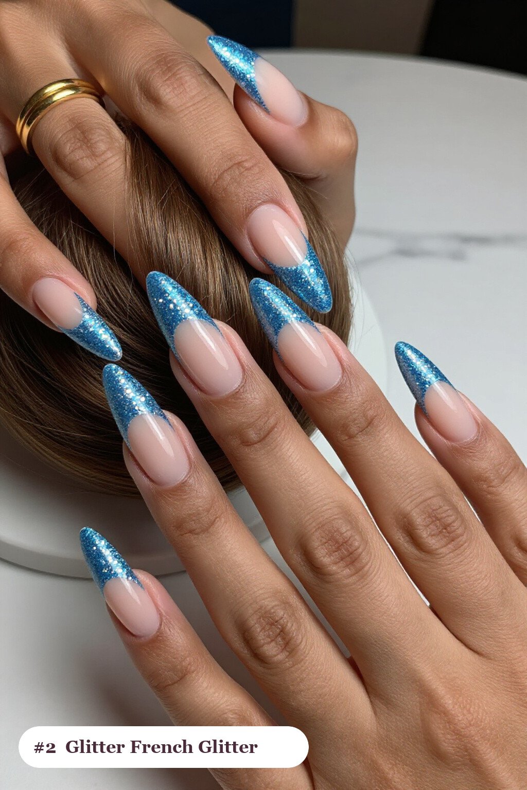 Long ballerina icy blue glitter nails with sparkling glitter clearly visible on every nail, styled with glitter-packed french tips over a sheer nude base, perfect for winter - winter glitter nails