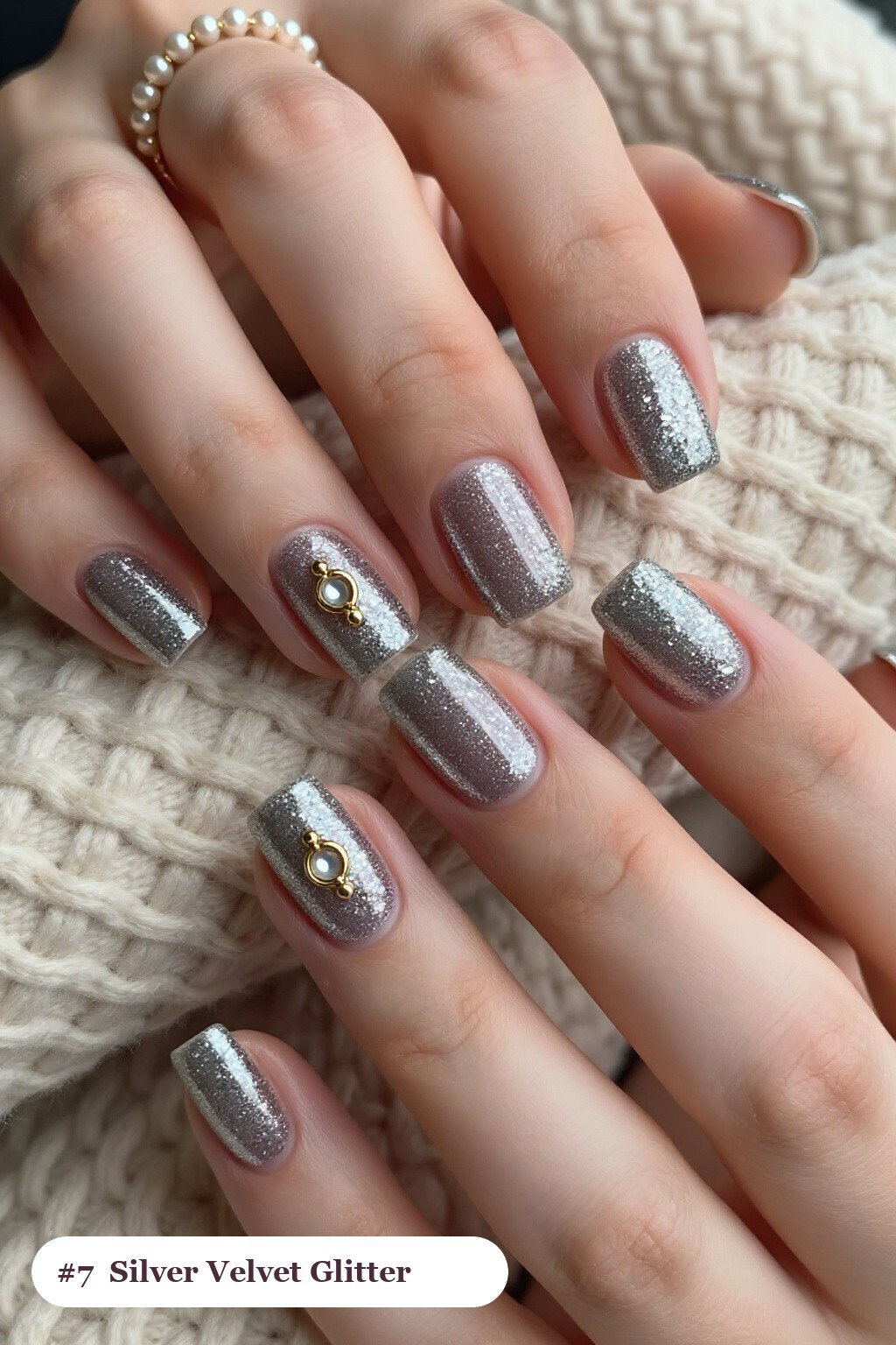 Short square silver glitter nails with sparkling glitter clearly visible on every nail, styled with a velvet shimmer finish with one glossy accent nail with a gold charm, perfect for winter - winter glitter nails