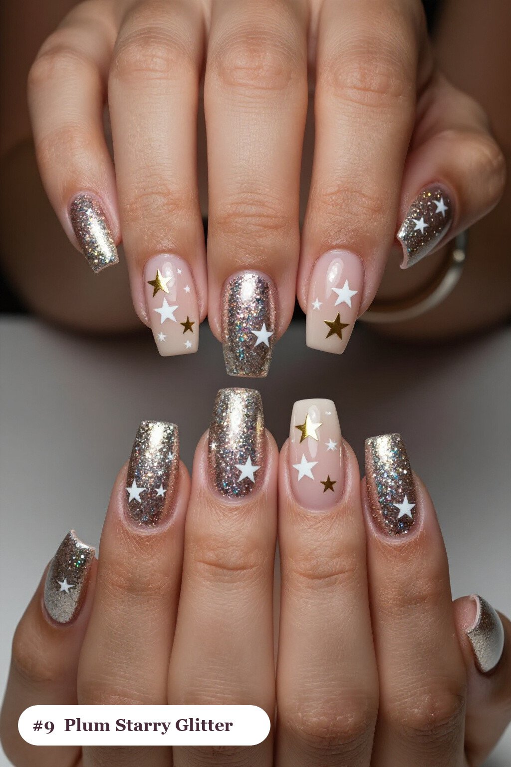 Long square plum glitter nails with sparkling glitter clearly visible on every nail, styled with white and gold stars and sparkles painted on every nail, perfect for winter - winter glitter nails