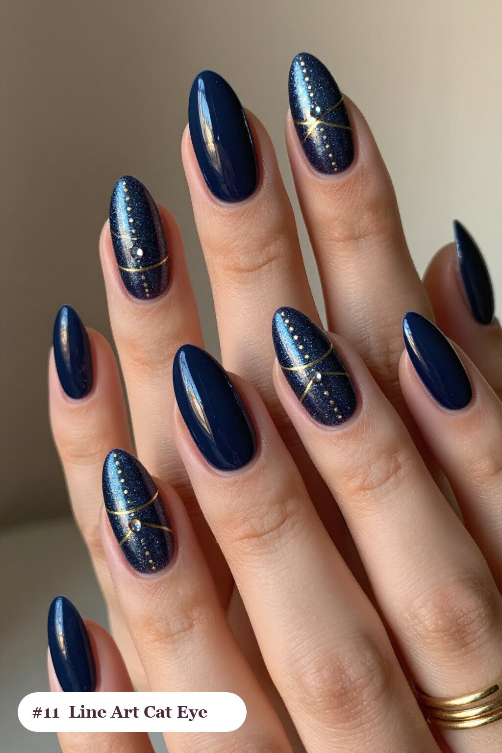 Medium Almond Deep Navy Cat Eye Nails with Fine Gold Line Art - winter nails cat eye