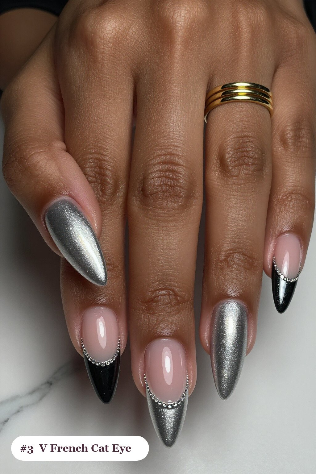 Silver Stiletto Cat Eye Nails Featuring Bold V‑French Tips - winter nails cat eye