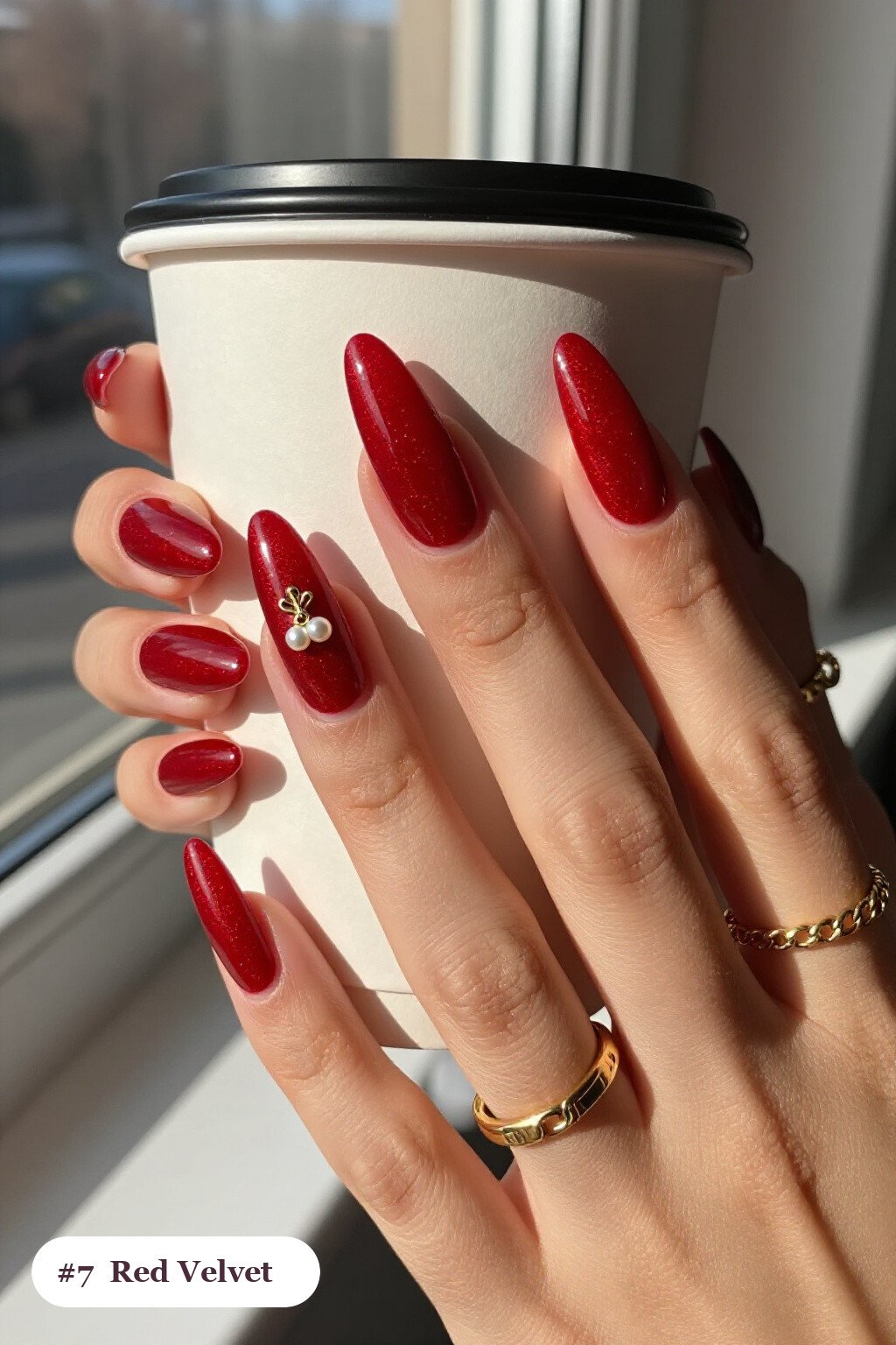 Long Almond Velvet‑Shimmer Red Nails With One Glossy Accent Nail and Gold Charm - winter red nails