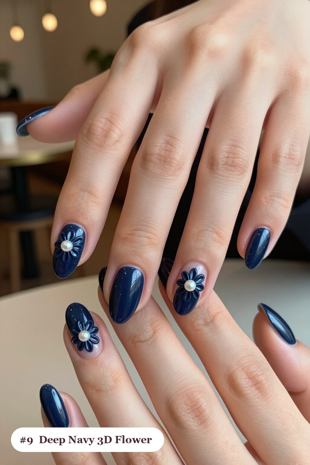 Deep Navy Short Almond Nails Featuring Raised 3D Pearl‑Center Flowers on Accents - winter short nails Deep Navy Short Almond Nails Featuring Raised 3D Pearl‑Center Flowers on Accents - winter short nails