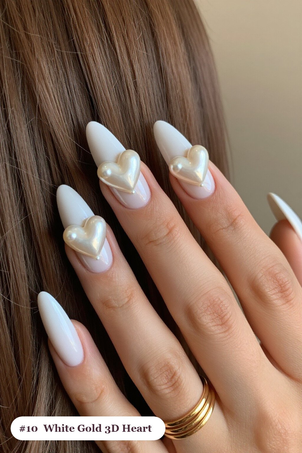 Long ballerina white gold nails with chunky 3D gel hearts and pearls on three nails, perfect for winter - winter white and gold nails
