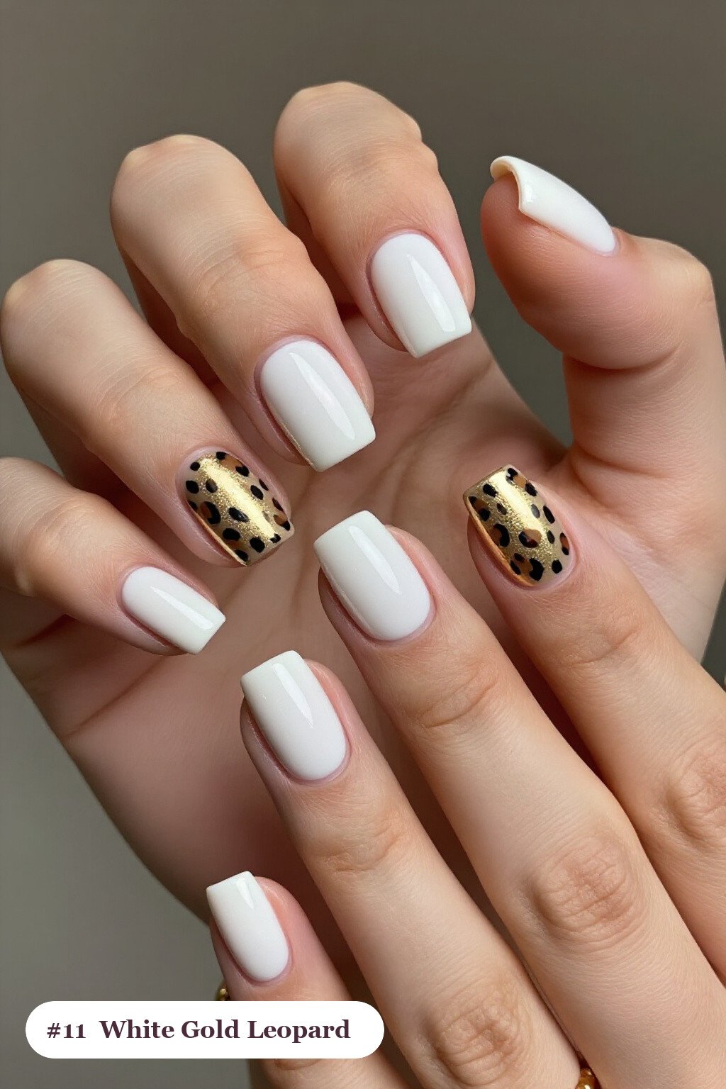 Short square white gold nails with a leopard print pattern on two accent nails and solid colour on the rest, with champagne details, perfect for winter - winter white and gold nails