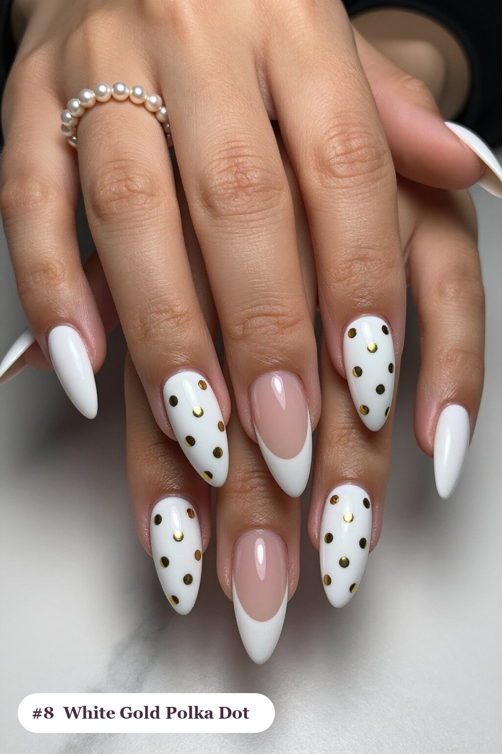 Long stiletto white gold nails with playful polka dots in two colours on alternating nails, with soft nude details, perfect for winter - winter white and gold nails