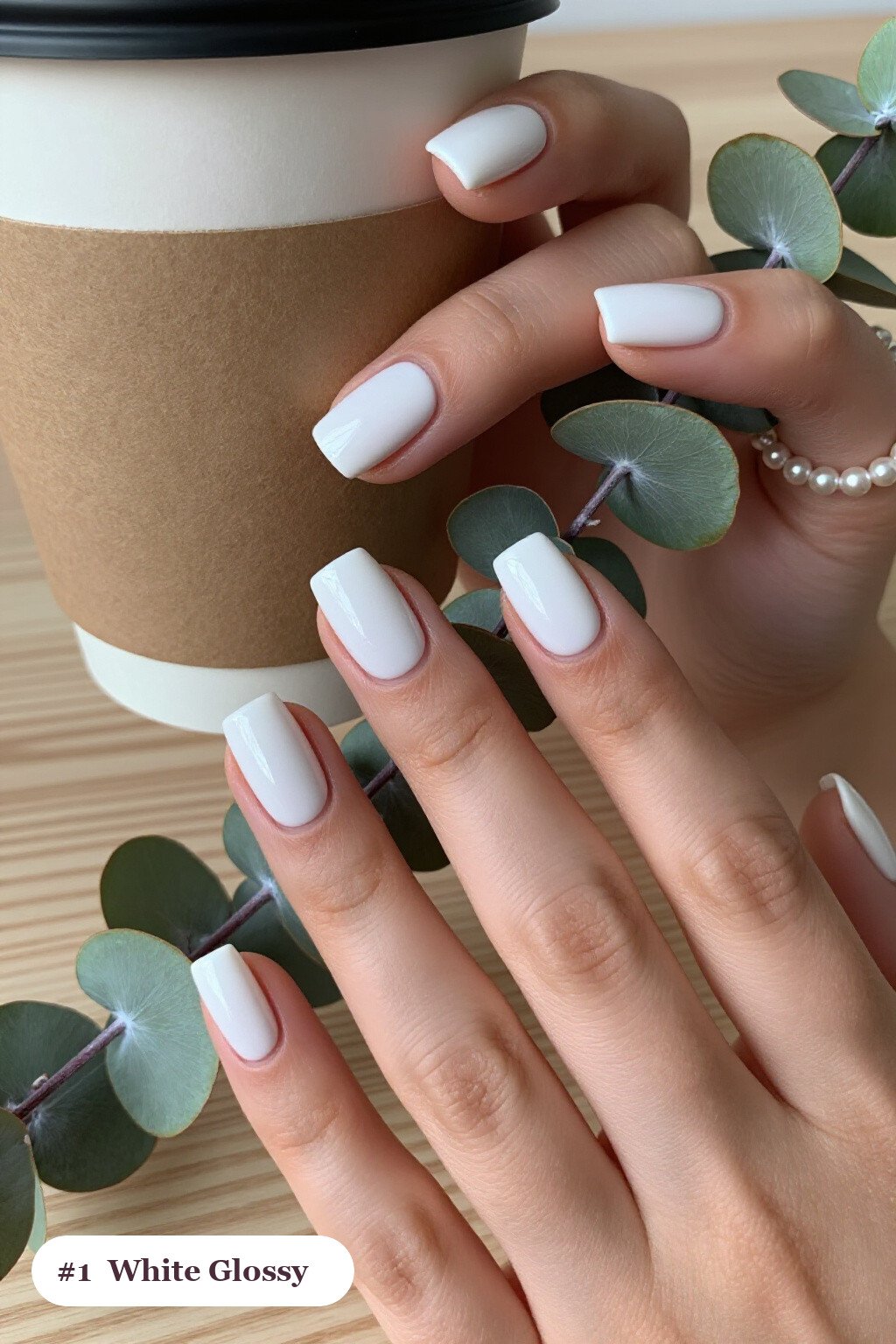 Short square white nails in a flawless mirror-glossy full-colour finish, perfect for winter - winter white nails