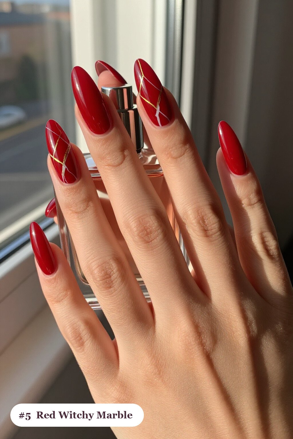 Blood‑Red Almond Nails with White & Gold Marble Veins - witchy halloween nail designs