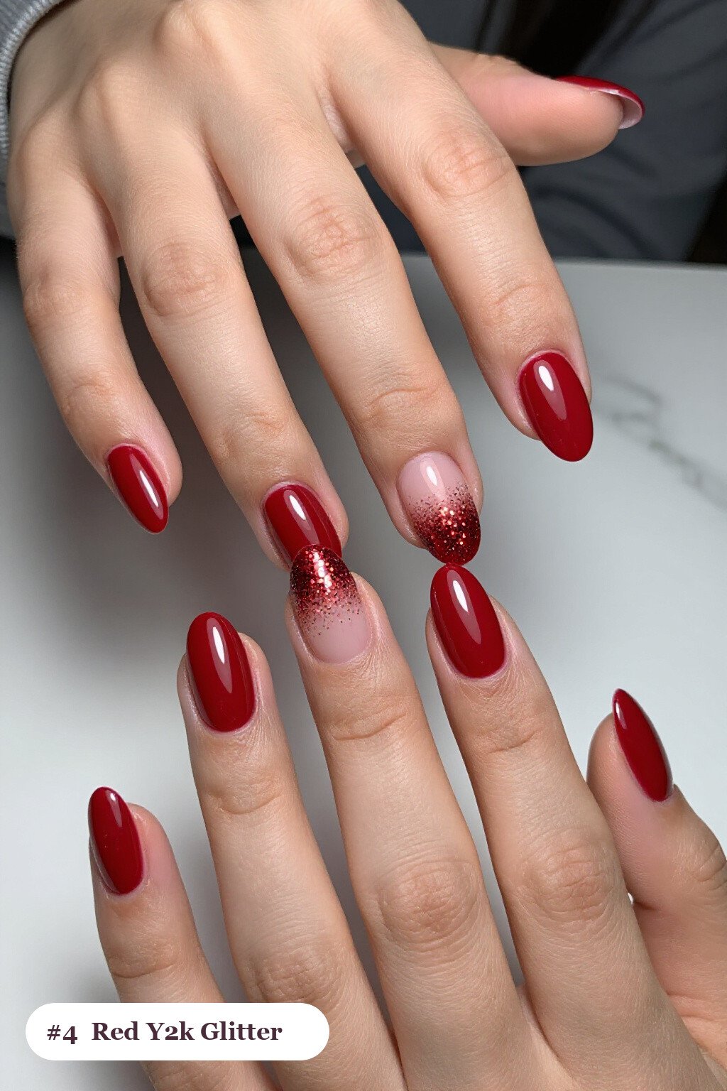Medium oval blood red y2k nails with a sparkling glitter gradient rising from the cuticle, perfect for halloween - y2k halloween nails